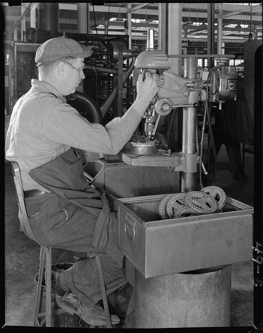 Man working at drill press - profile