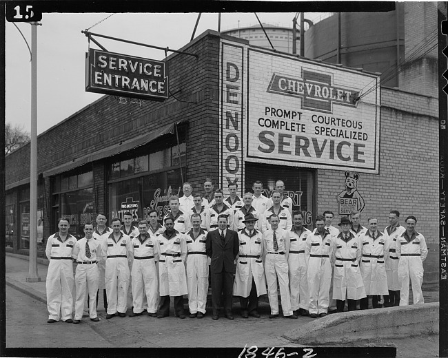 Workers outside DeNooyers Chevrolet