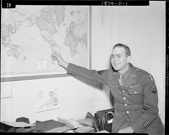 Soldier pointing to map