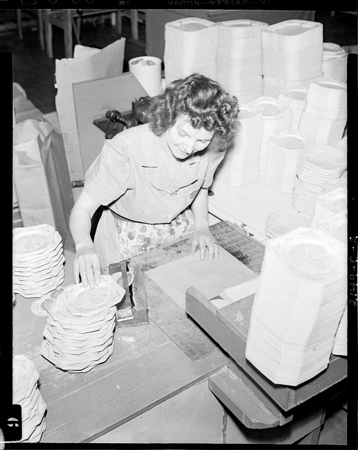 Woman at work making paper plates