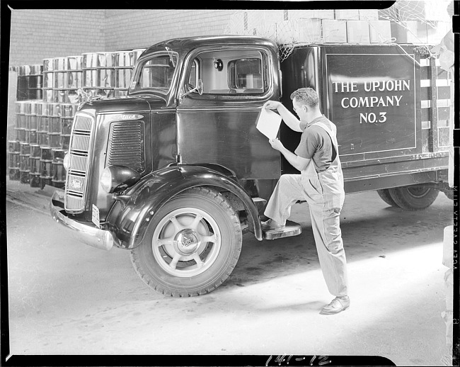 Man with Upjohn Company delivery truck