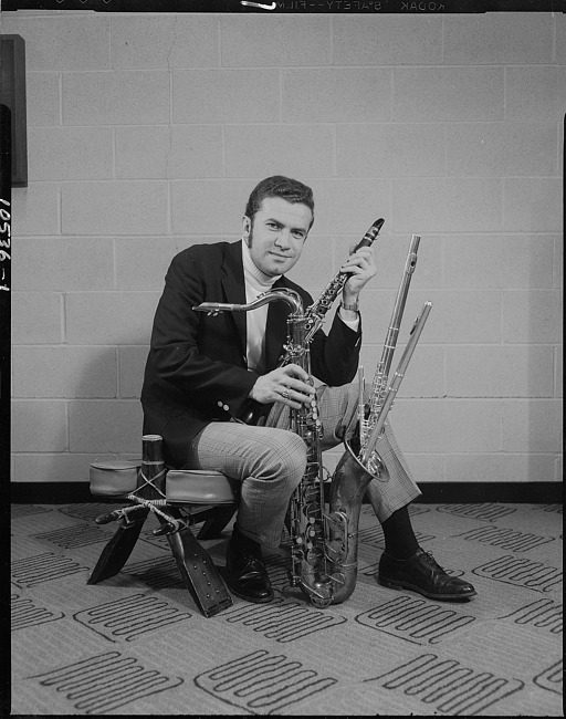 Man posing with musical instruments