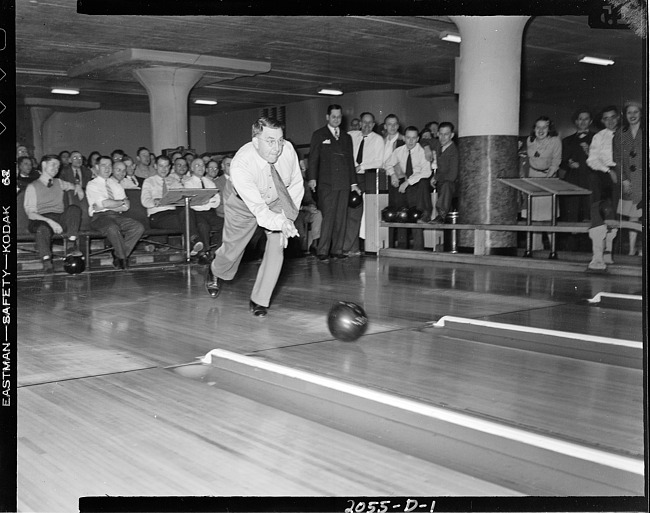 Man bowling at company tournament