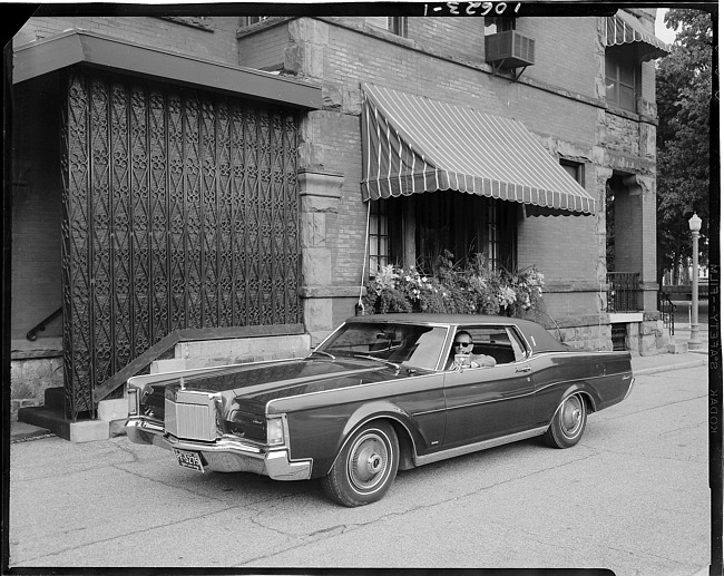 Man in a 1969 Lincoln Continental Mark III