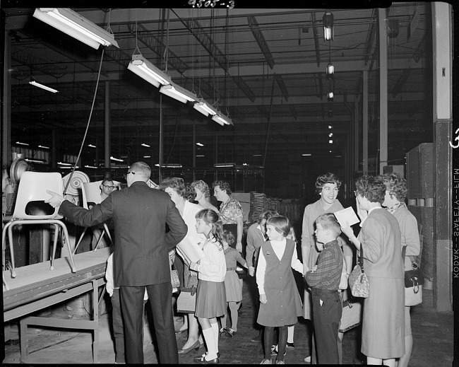Children and adults in warehouse