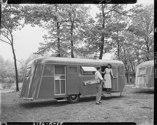 Couple with Kozy Coach trailer