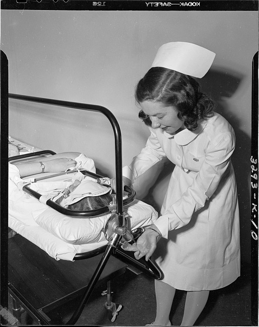 Nurse adjusting an orthopedic frame