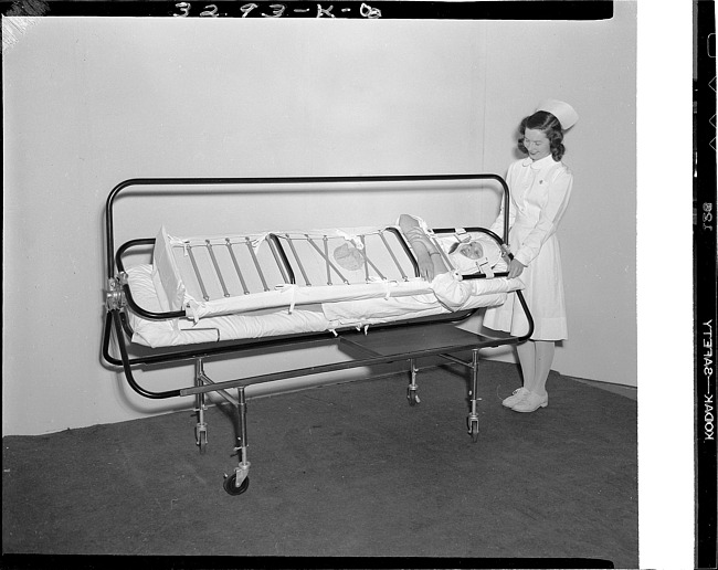 Nurse with patient on bed frame