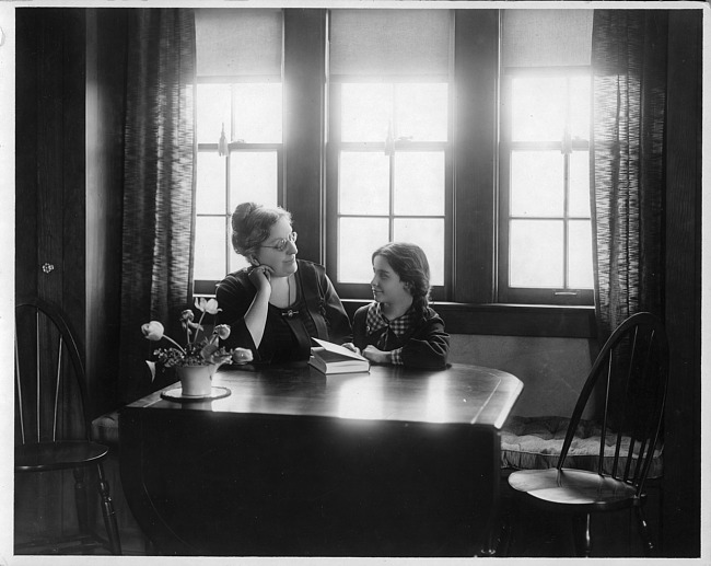 Caroline Bartlett Crane with daughter in dining room of "Everyman's House", photograph