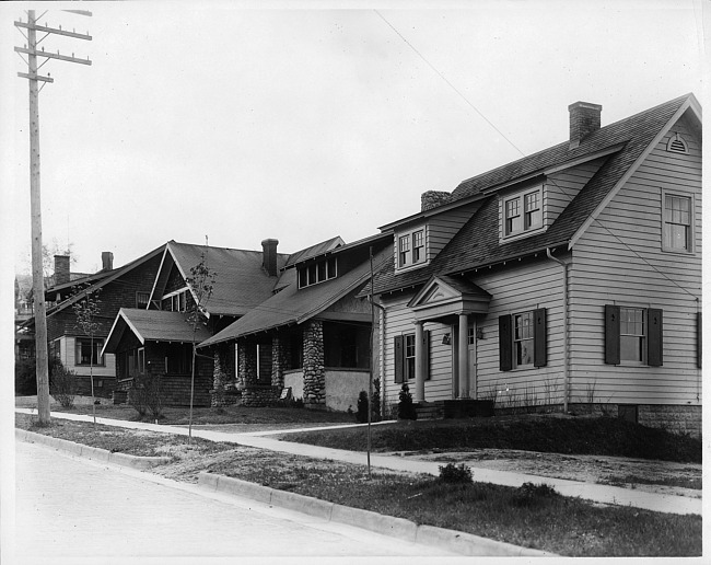 Front exterior view with neighboring houses, photograph