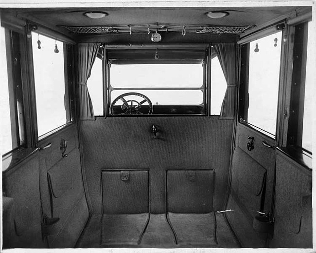 1917 Packard landaulet, view of interior from rear seat, shown with forward auxiliary seats folded