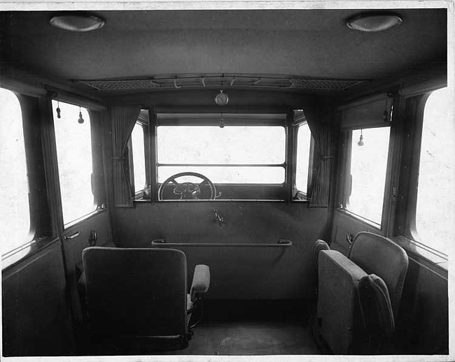 1917 Packard imperial limousine, view of interior from rear seat, shown with side auxiliary seats