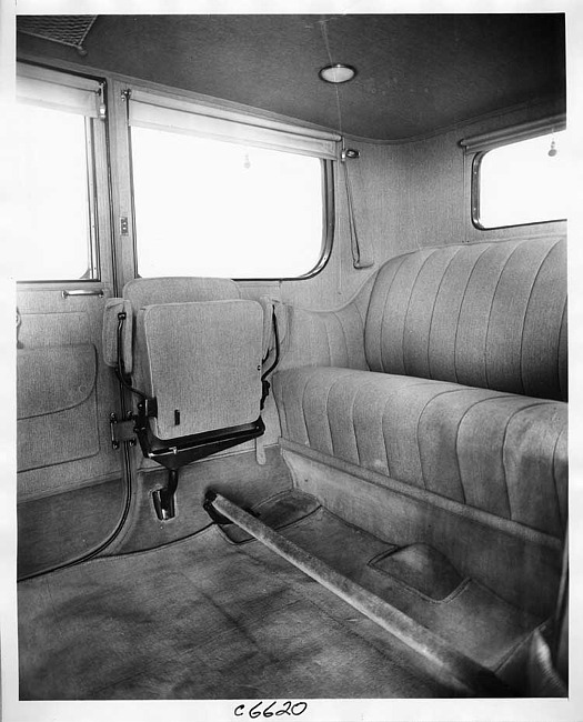 1917 Packard brougham, view of rear interior from right side door, showing side auxiliary seat folded