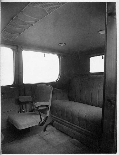 1917 Packard cab side limousine, view of rear interior from left side door, showing side-folding auxiliary seat