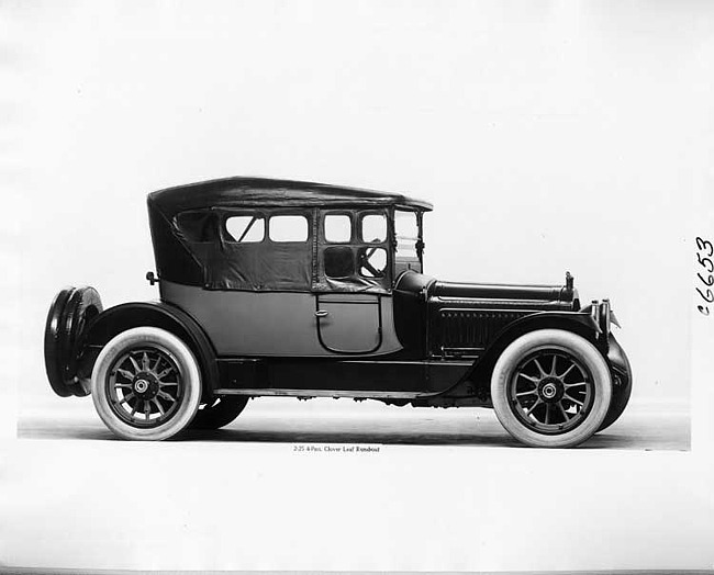 1917 Packard two-toned cloverleaf runabout, top raised, side curtains in place, right side view