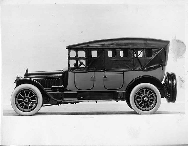 1917 Packard two-toned touring car, top raised, side curtains in place, left side view