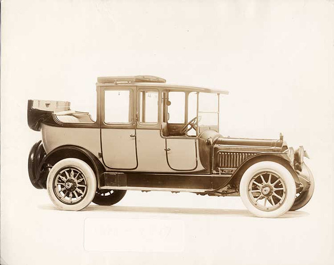 1917 Packard cab side two-toned landaulet, back quarter collapsed, three-quarter right front view