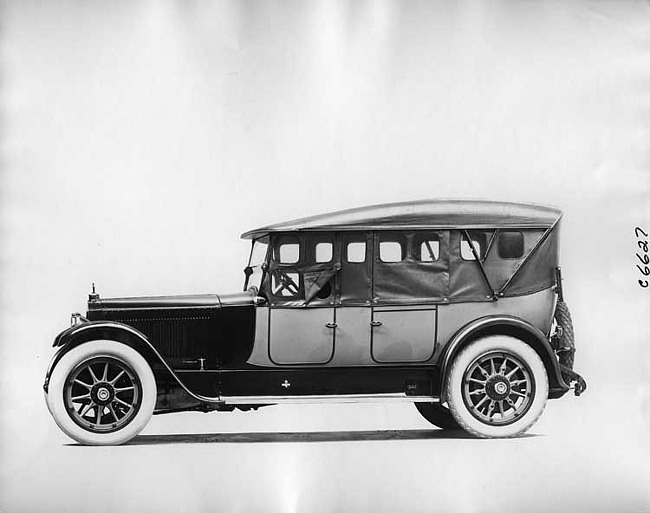 1918 Packard two-toned touring car, left side view, top raised, side curtains in place