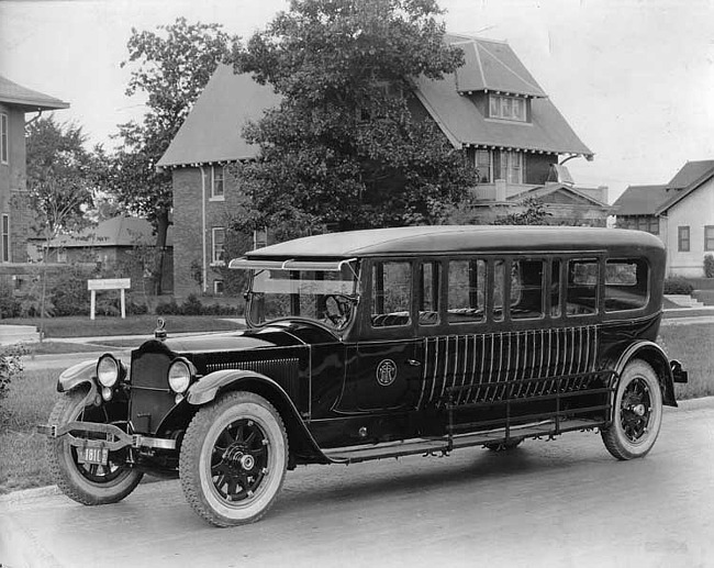 1920-1923 Packard special 5-door commuter bus parked on residential street