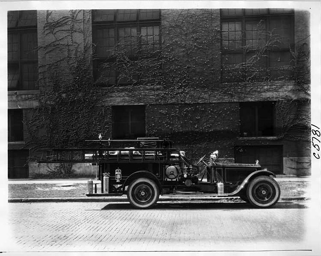 1924 Packard fire truck parked on street in front of brick building