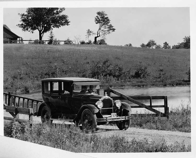 1925 Packard sedan crossing country, wooden bridge