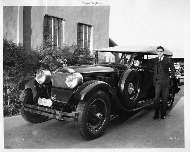 1925-1926 Packard sport model, front view, top raised, Lloyd Hughes standing at driver's door