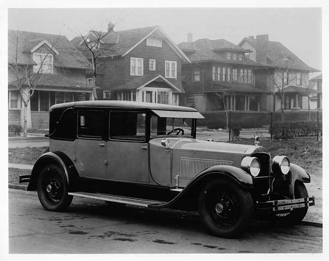 1927 Packard two-toned special berline, parked on residential street
