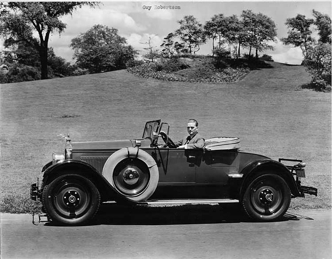 1927 Packard runabout, right side view, top lowered, male behind wheel