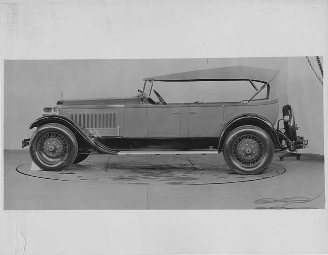 1927 Packard phaeton, left side view, top raised, light in color