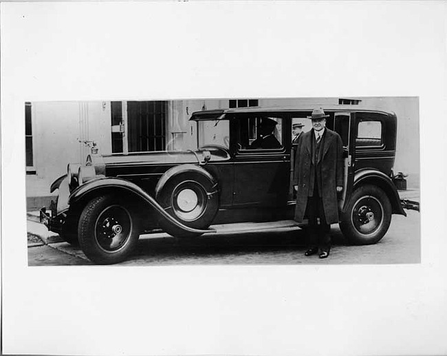 1928 Packard sedan limousine, President Herbert Hoover standing at passenger door