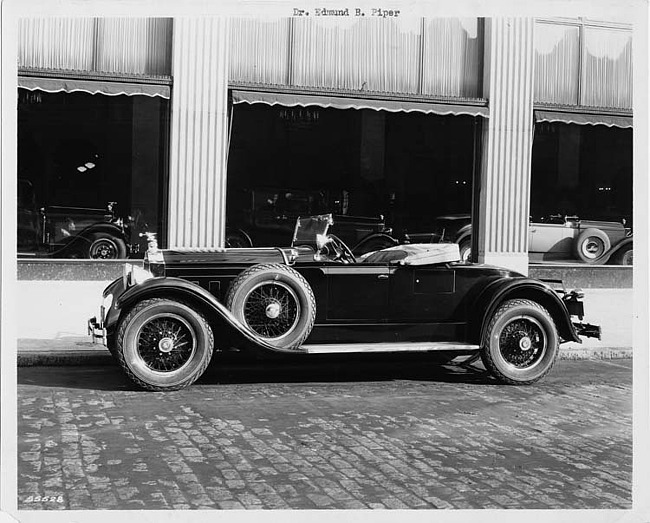 1929 Packard runabout, right side view, top folded, parked on street