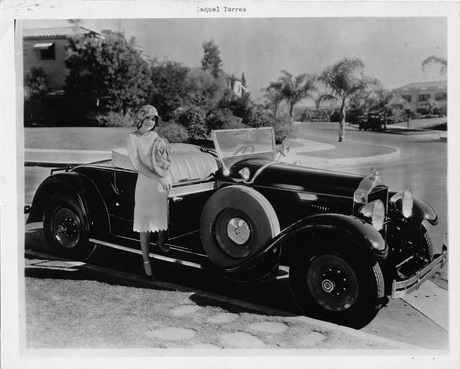 1929 Packard runabout, actress Raquel Torres standing on running board