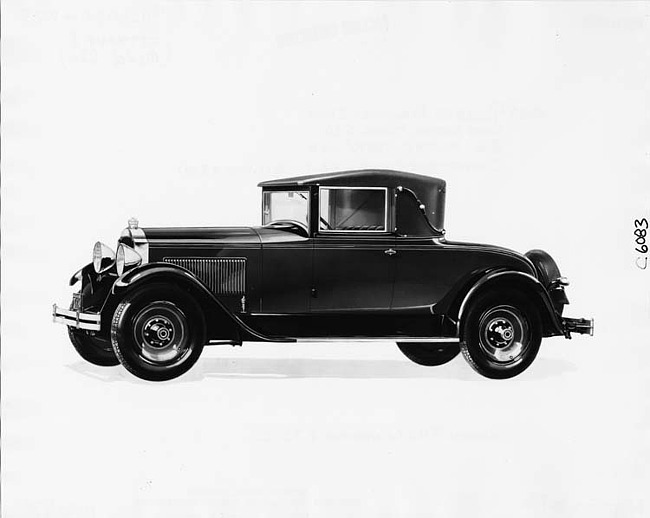 1929 Packard convertible coupe, nine-tenths left front view, top raised