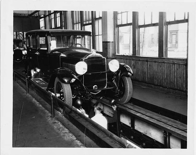 1929 Packard sedan, three-quarter front view, coming down final inspection line