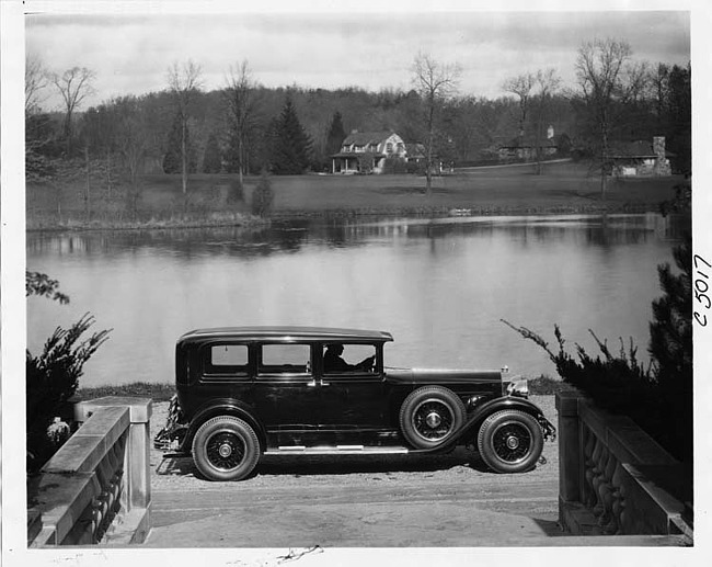 1930 Packard sedan limousine parked at water's edge