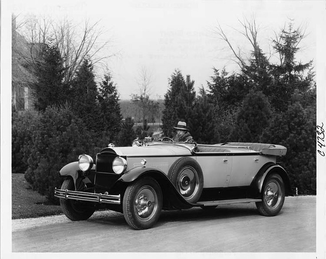 1930 Packard sport phaeton, three-quarter right front view, top folded, male driver