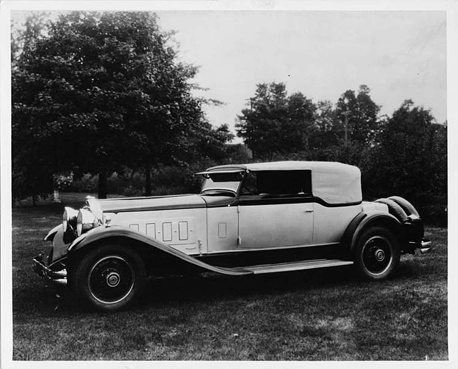 1930 Packard convertible Victoria, seven-eighths left front view, top raised