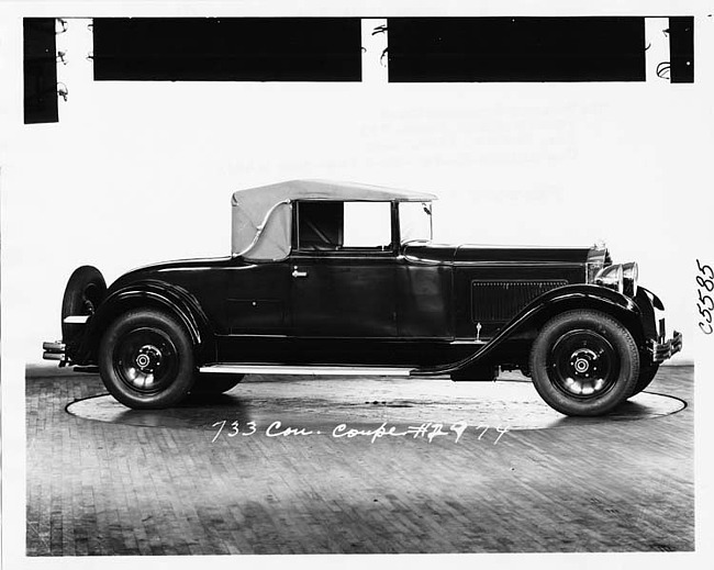 1930 Packard convertible coupe, nine-tenths right side view, top raised