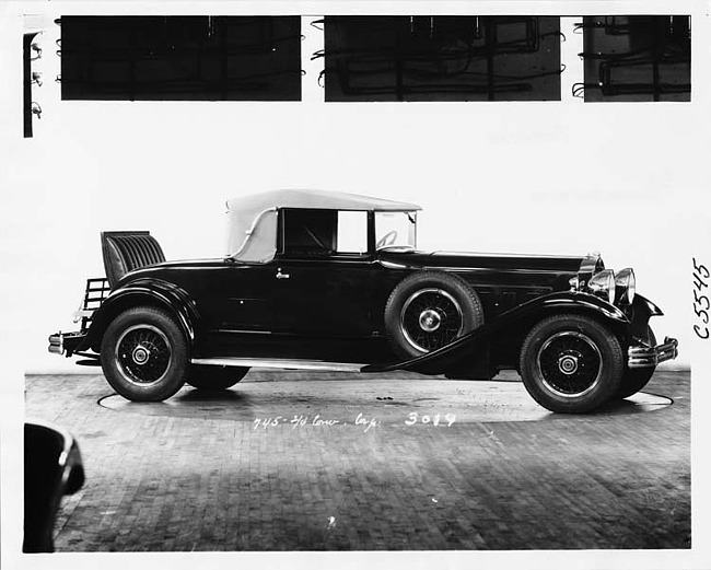 1930 Packard convertible coupe, nine-tenths right side view, top raised, rumble seat open