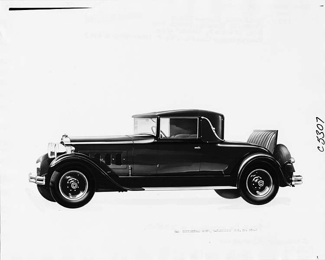 1930 Packard convertible coupe, nine-tenths left side view, top raised, rumble seat open