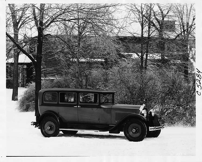 1930 Packard sedan, nine-tenths right side view, parked in snow