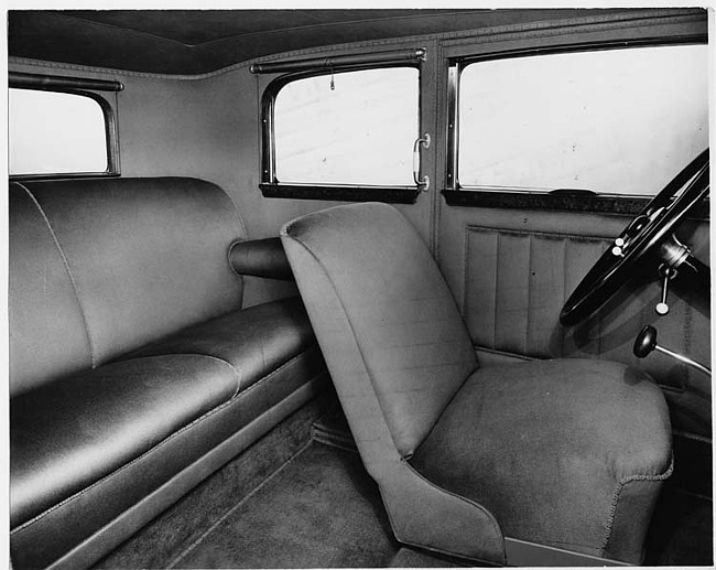 1930 Packard sedan, view of interior through rear passenger door, steering wheel visible