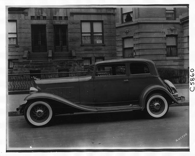 1932 Packard coupe sedan, left side view, parked on street