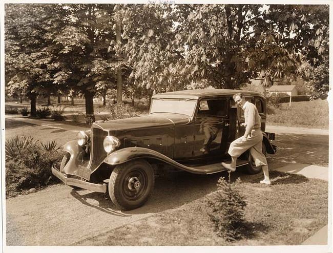 1932 Packard sedan, owner Guy Bonham standing at driver's door, Long Island, N.Y.