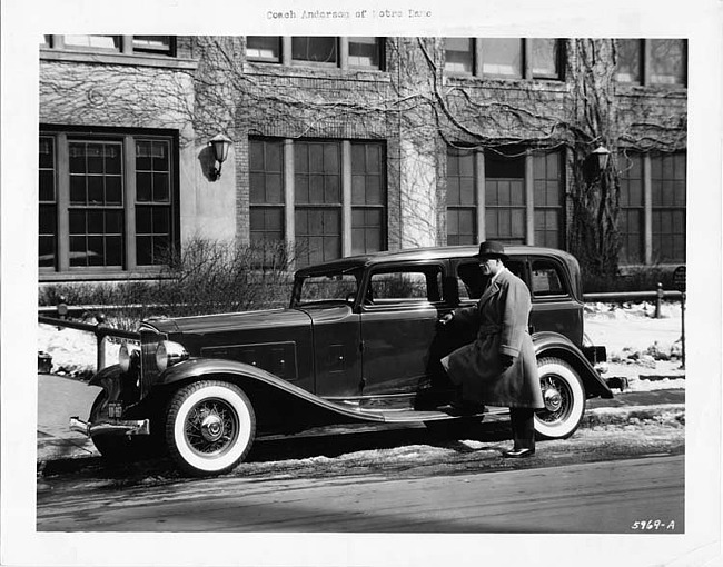 1932 Packard sedan, owner coach Heartly 'Hunk' Anderson at driver's door