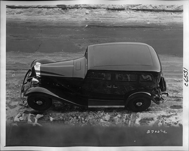 1933 Packard sedan, left side top view, parked on street