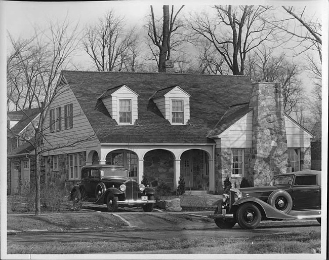 1933 Packard coupes, in driveway and on street in front of house