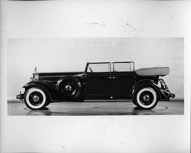 1933 Packard convertible sedan, left side view, top folded, windows rolled up