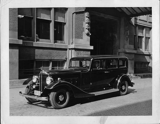 1933 Packard sedan limousine parked in front of the B.F. Goodrich Company