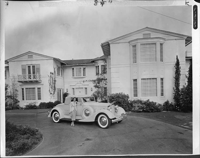 1934 Packard coupe roadster parked in driveway of Miss Arline Judge's home